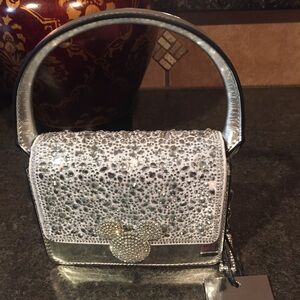 The Disney x ALDO Top Handle/Cross body Platinum Collection is dazzling. NWT